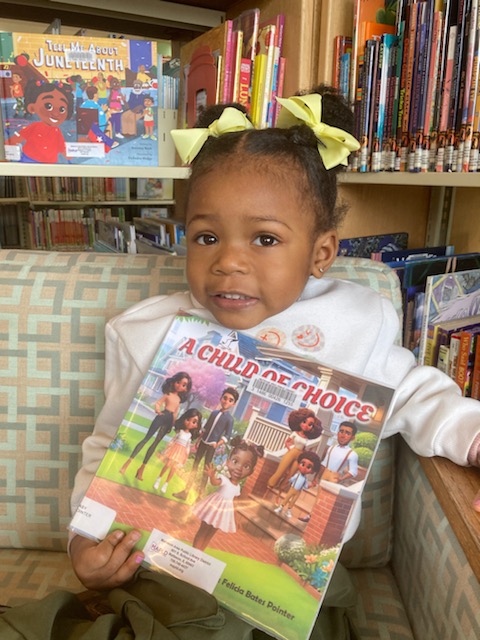 Young reader smiling with A Child of Choice